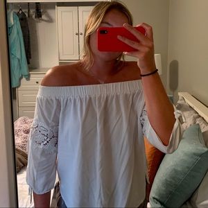 Off the shoulder white blouse.